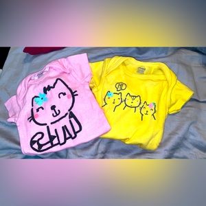Two kitty cat onesies